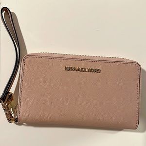 Michael Kors wristlet wallet with phone carrier.